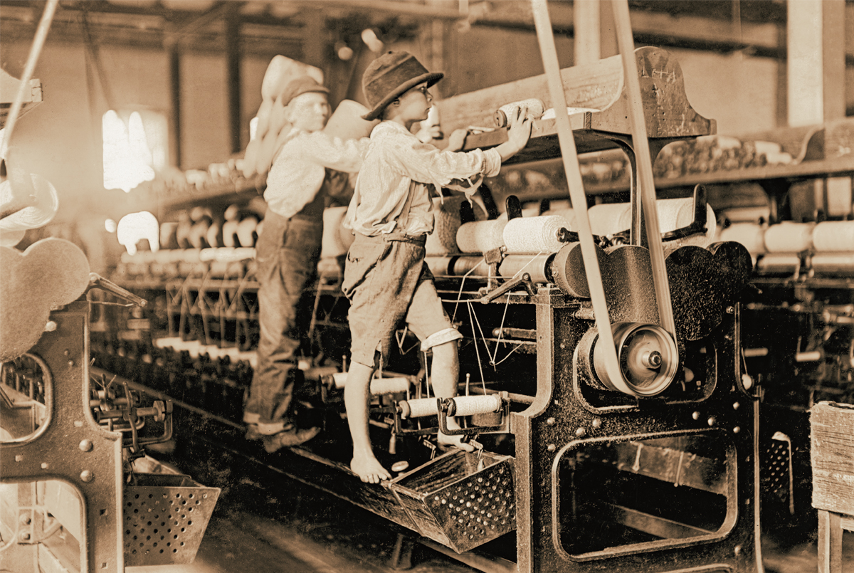 Sepia tone photo of teens working in a factory