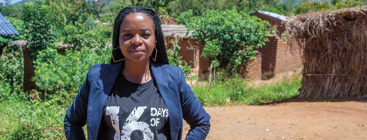 Image of person posing in village