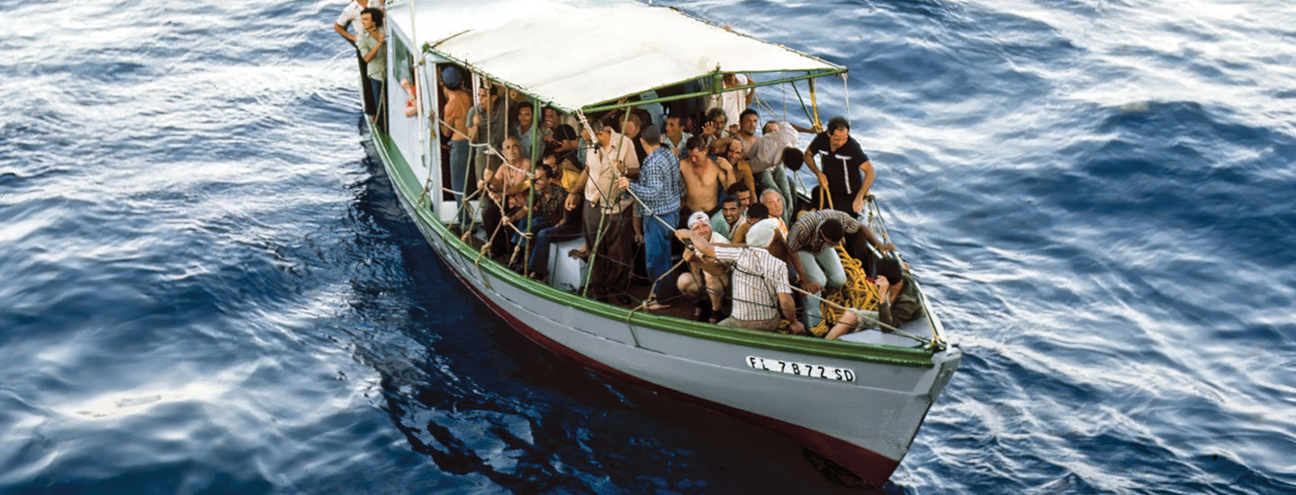 Bird&apos;s eye view of a small boat packed with people